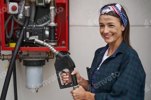 Preview: Beautiful woman in shirt holing refueling hose isolated on white background