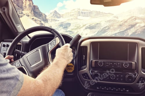 Preview: Driving a car or truck on a rural road through the mountains