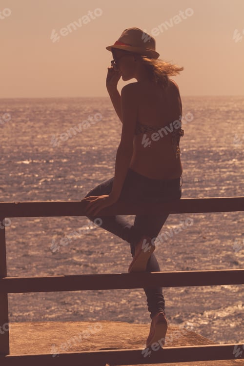Preview: Silhouette Of A Young Girl Enjoying The Ocean / Sea.
