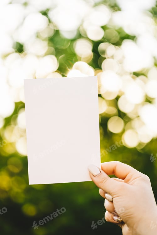 Preview: Paper empty blank background backdrop against garden bokeh. Copy space Handicraft. Frame design