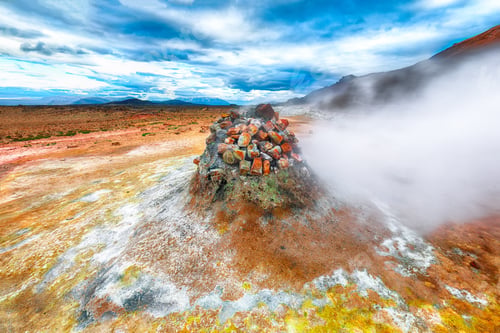 Preview: Steaming cone in Hverir geothermal area with boiling mudpools and steaming fumaroles in Iceland