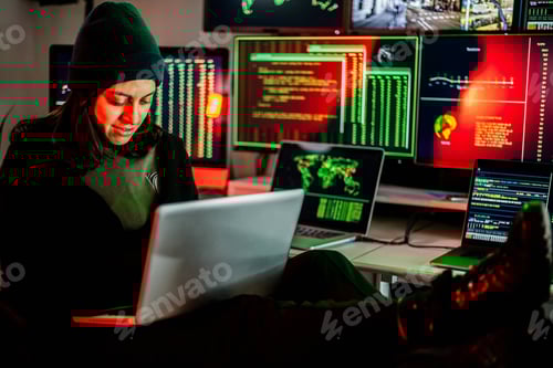 Preview: Hacker breaking into corporate network using laptop and multiple screens