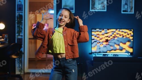Preview: Kid influencer having fun dancing in home studio, recording video for generation z internet users