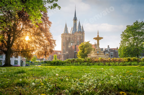 Preview: The historical Sassenpoort landmark in Zwolle, Netherlands with green gardens around it