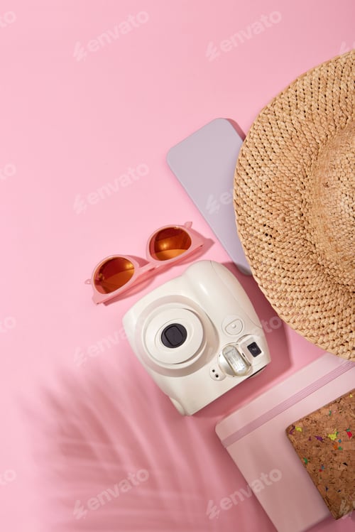 Preview: Instant camera near sunglasses and hat pink
