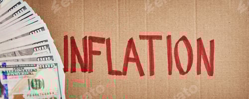 Preview: World inflation concept. Cardboard with word inflation and usd banknotes