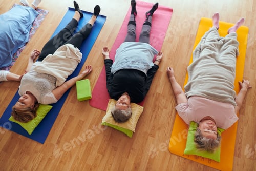 Preview: Top view of group of senior women engage in various yoga exercises, including neck, back, and leg