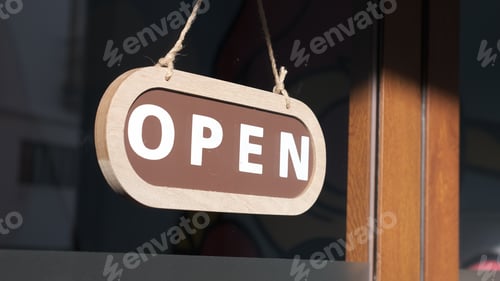 Preview: Small business opening up. Turning the sign to open