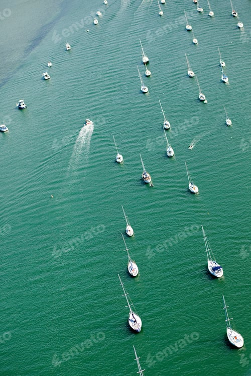 Preview: Boats floating peacefully on a serene green sea
