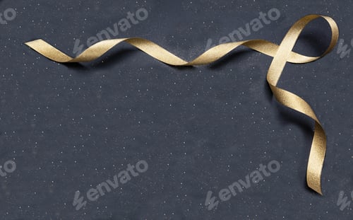 Preview: Golden satin ribbon on black background, copy space