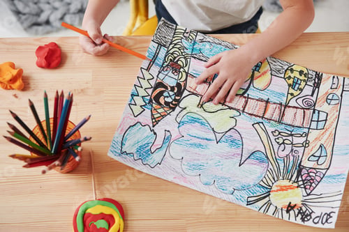 Preview: Particle photo. Cute little girl in art school draws her first paintings by pencils and markers