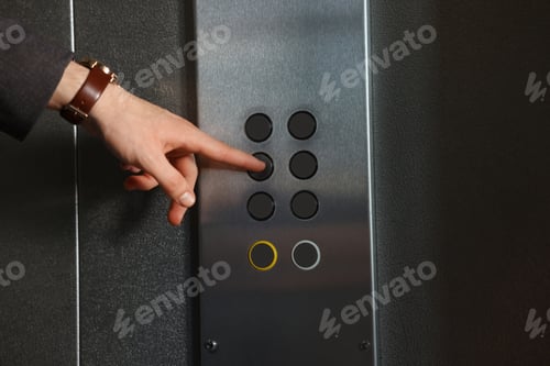 Preview: Man choosing floor in elevator, closeup view