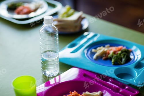 Preview: Food with water bottles on table
