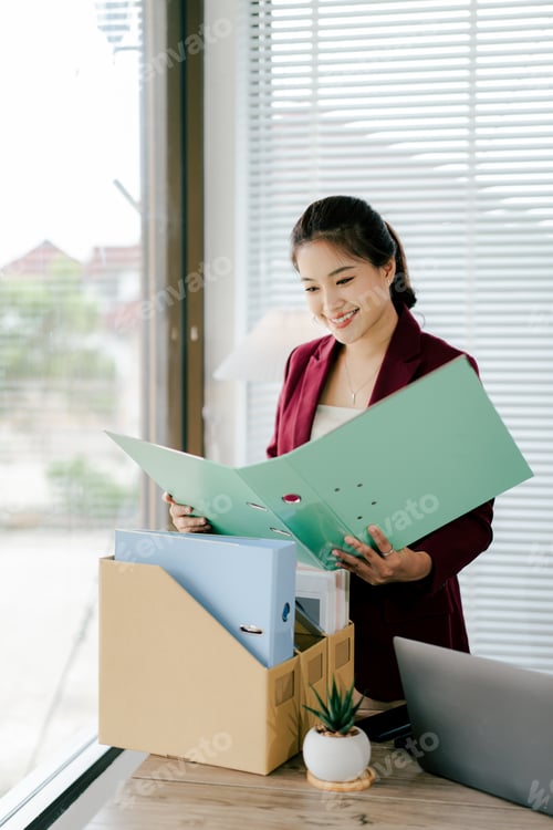 Preview: Female secretary holding file searching for documents in office. Young woman checking business