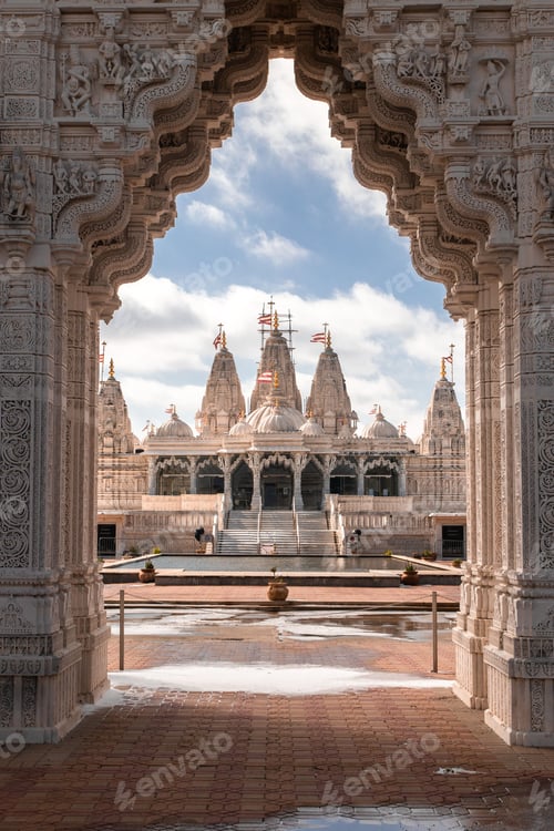 Preview: Ornate Hindu temple architecture against blue sky.