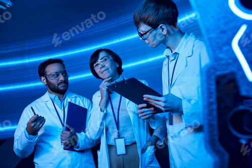 Preview: innovation hub, multiethnic scientists working on invention in futuristic science center