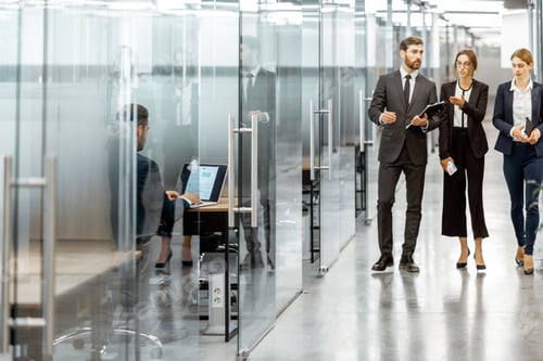 Preview: Business people in the hallway of the modern office building