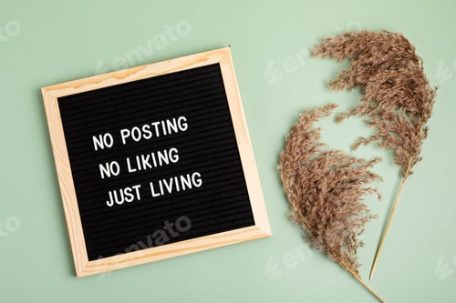 Preview: No posting, no liking, just living motivational quote on the letter board. Inspiration text for