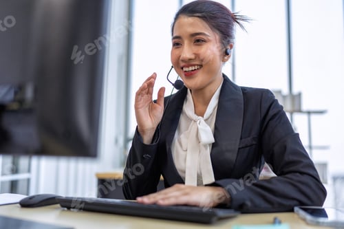 Preview: Operator agent with headsets working in a call center giving help as a customer service officer