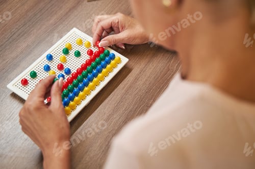 Preview: Female person during recovery of motor skills in rehabilitation center