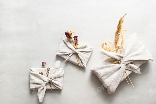 Preview: Presents Wrapped in Fabric and Decorated Dried Flowers.