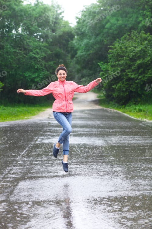 Preview: Rain city happy girl jumping in the puddle