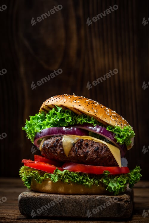 Preview: Grilled Burger with Vegetables on Wooden Background