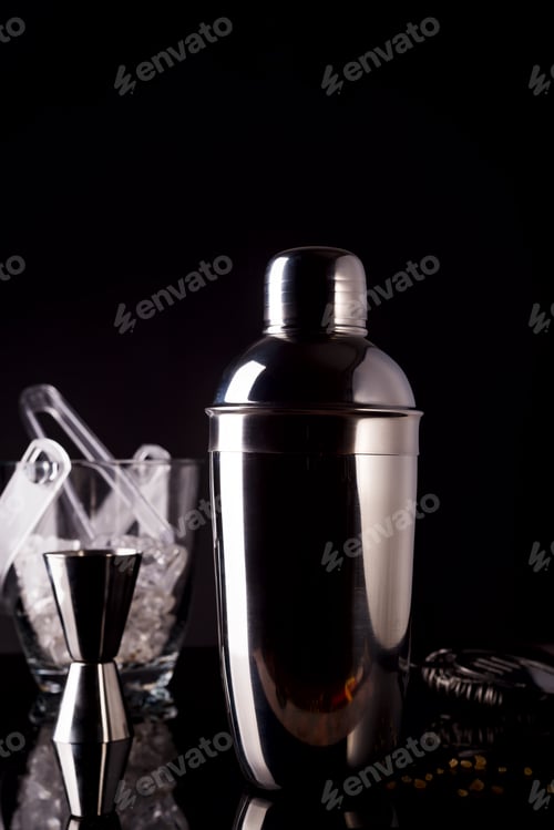 Preview: Cocktail shaker, swizzle, tongs and spoon with ice in a bucket for preparing a summer