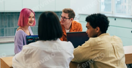 Preview: young programmers working on a new project for a start up business.