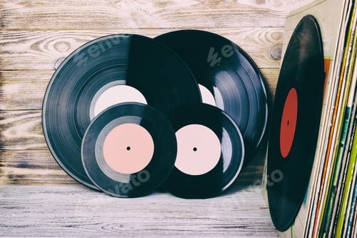 Preview: Retro styled image of a collection of old vinyl record lp's with sleeves