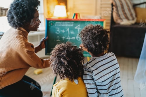 Preview: Happy children learning maths with mother, teacher at home. Family education happiness concept