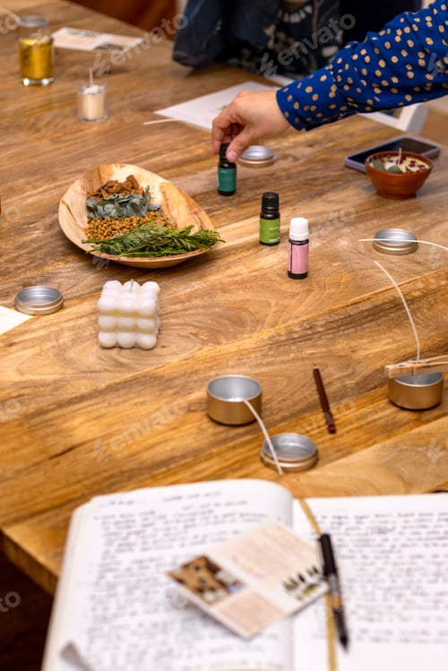 Preview: Soy candle creation workshop. Work table with essential oils and flowers to decorate the soy candles