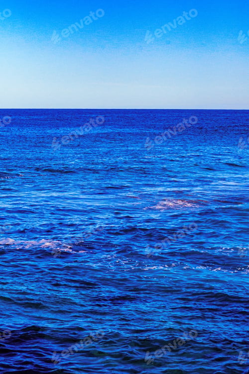 Preview: Vertical shot of the pure blue water of the sea