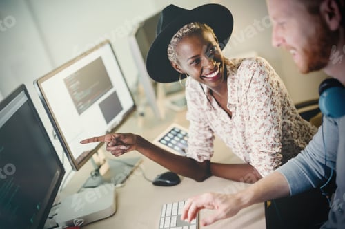 Preview: Programmers cooperating at information technology company