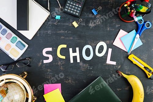 Preview: Different school supplies on dark background. Concept Back to school