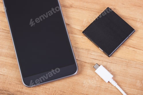 Preview: Mobile phone, plug of charger and telephone battery