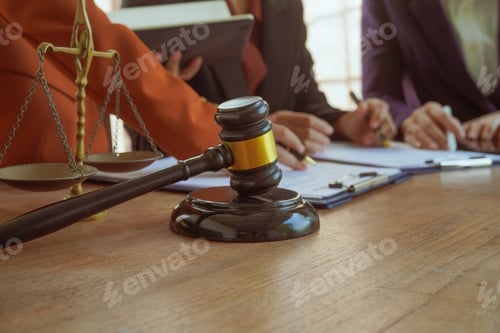 Preview: A group of lawyers and clients engage in a professional meeting law office, discussing agreements