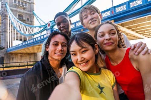 Preview: Multiracial group of happy young friends bonding in London