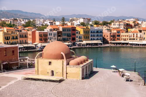 Preview: Chania old venetian harbour, Crete island. Traditional waterfront buildings and Hassan Pascha mosque