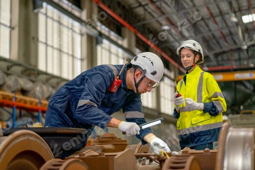 Preview: Professional technician man hold light stick to check and fix problem of parts of electric train