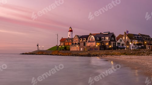 Preview: Urk Flevoland Netherlands sunset at the lighthouse and harbor of Urk Holland