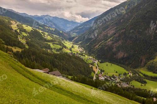 Preview: Grossglockner. Serpentine alpine road viewpoint. Green forest and valley. Austria