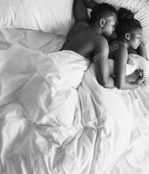 Preview: Black and white photo of African descent couple sleeping on the