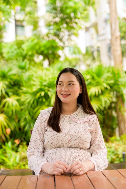 Preview: Pregnant woman portrait outdoors