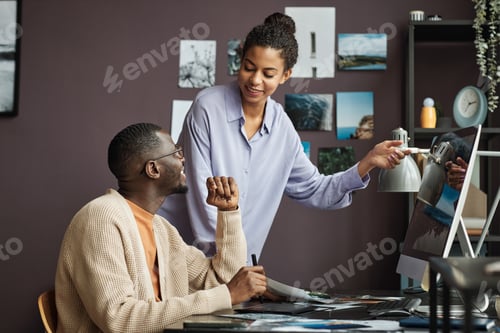 Preview: Creative Team Discussing Photos