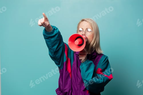 Preview: Style blonde woman in glasses with loudspeaker
