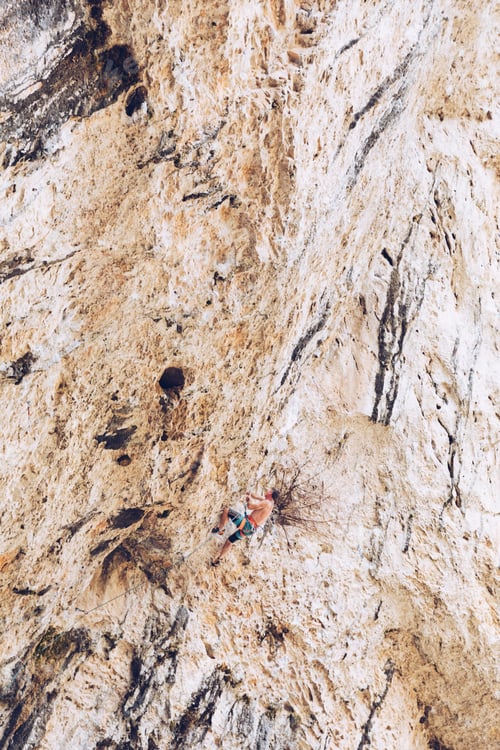 Preview: Anonymous man climbing rock