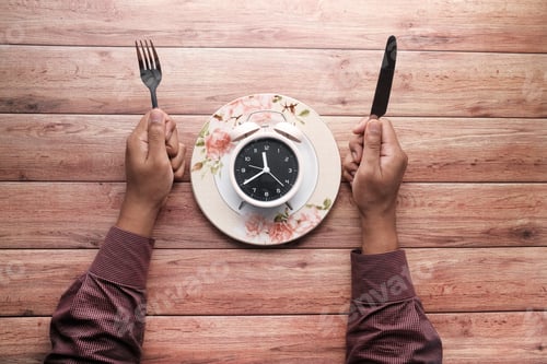 Preview: the concept of Healthy Food, alarm clock on plate