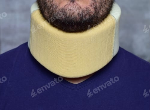 Preview: Closeup of a collar on a Caucasian man's neck for recovery