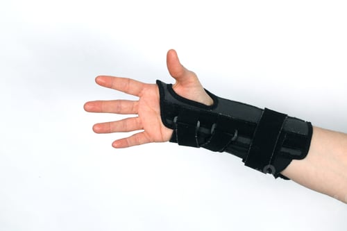 Preview: Closeup shot of a hand in an orthopedic medical fitness wrist bandage